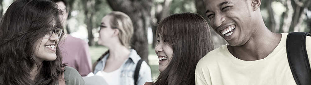 Faces of male and women students of different ethnicities.