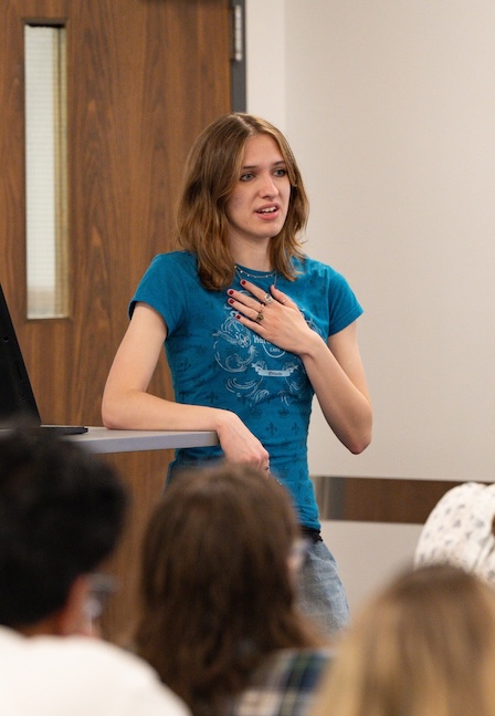 student speaking in front of class